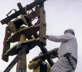 The upper frame of a traction trebuchet is assembled.