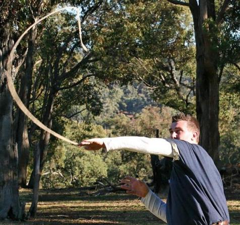 Matt S in mid throw with a hand sling .... photo by ?